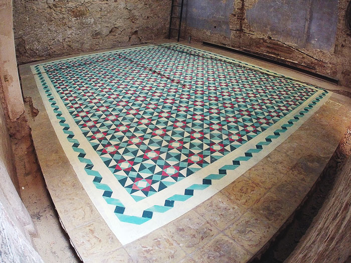 Artist Spray Paints Floors Of Abandoned Buildings With Colorful Tile Patterns