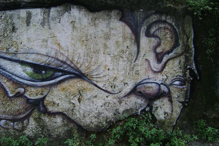 Street Artist Turns Rocks And Ruins Into Faces