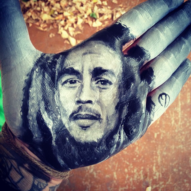 School Teacher Paints Realistic Portraits On His Hand And Stamps Them On Paper