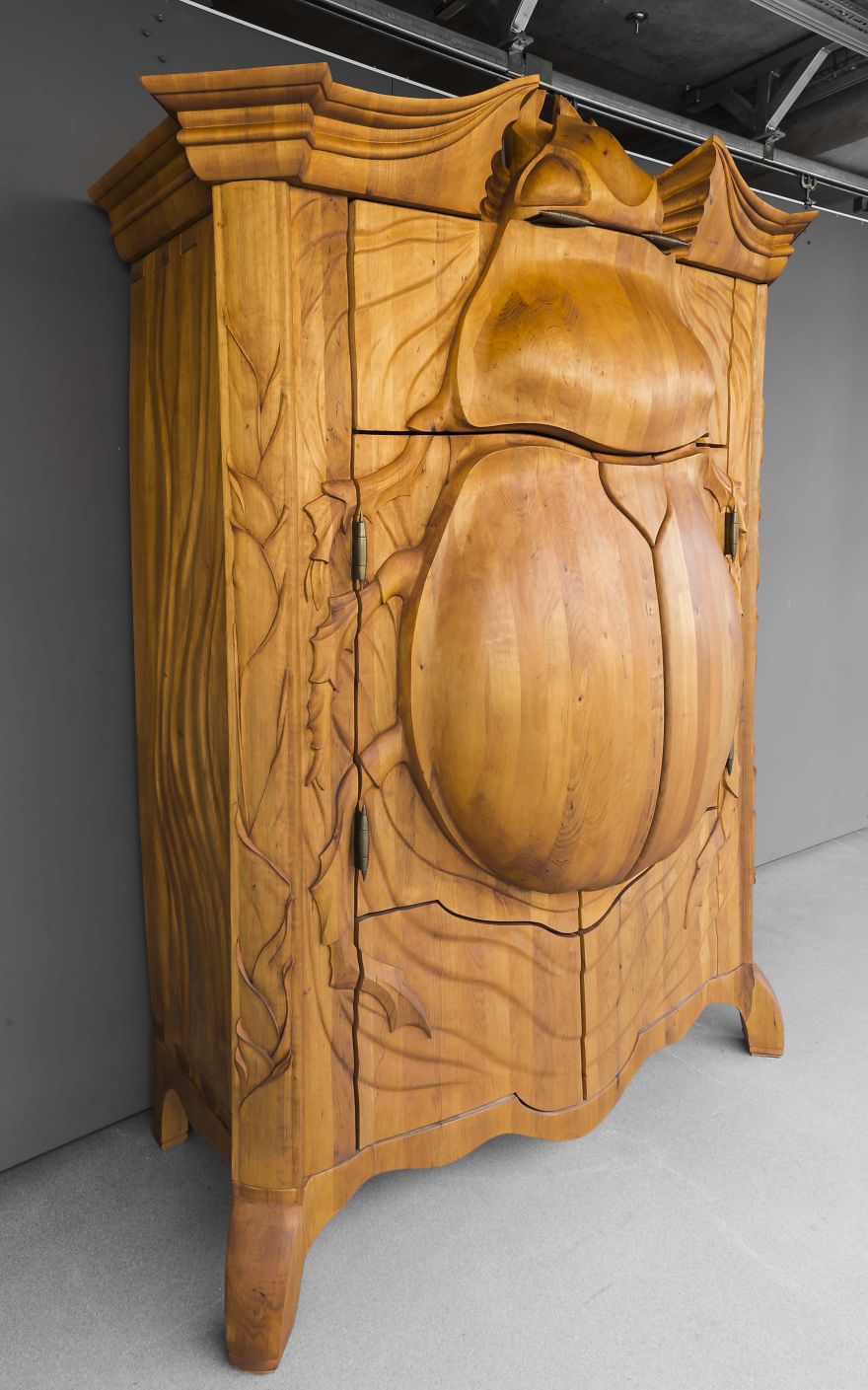 Latvian Artist Carves Wood Cabinet In Shape Of Giant Beetle
