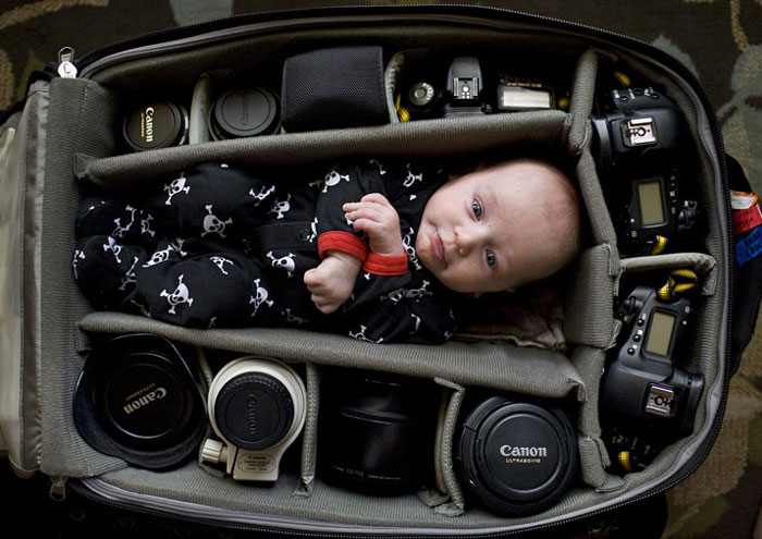 Baby In Camera Bag