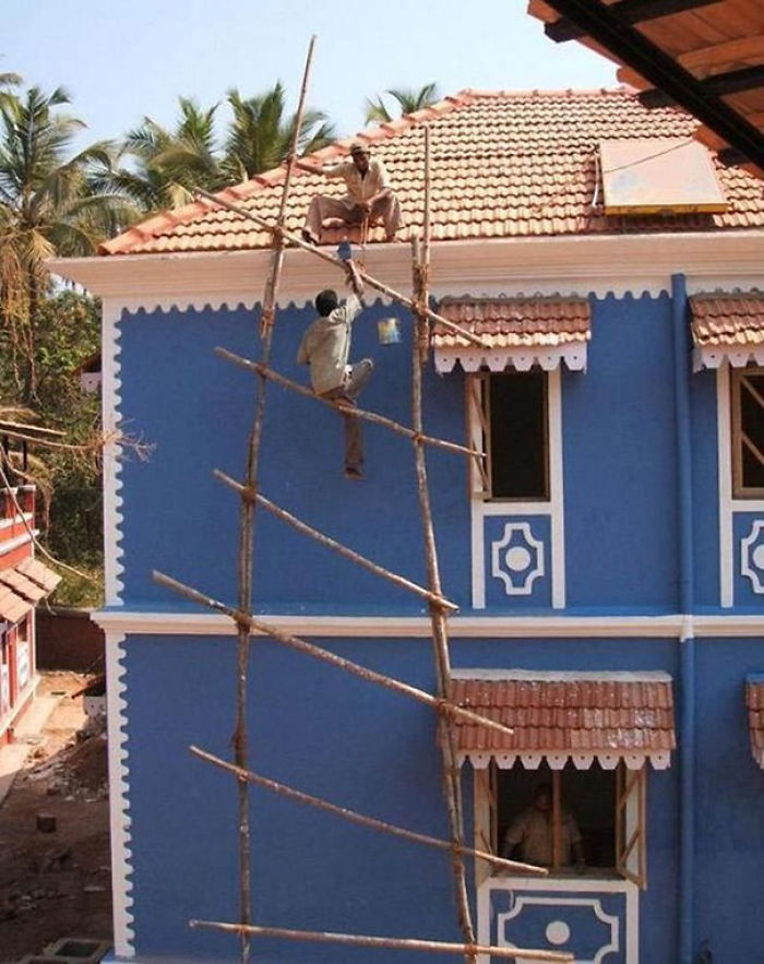 Two men engaged in a risky activity, demonstrating reasons why women live longer than men.