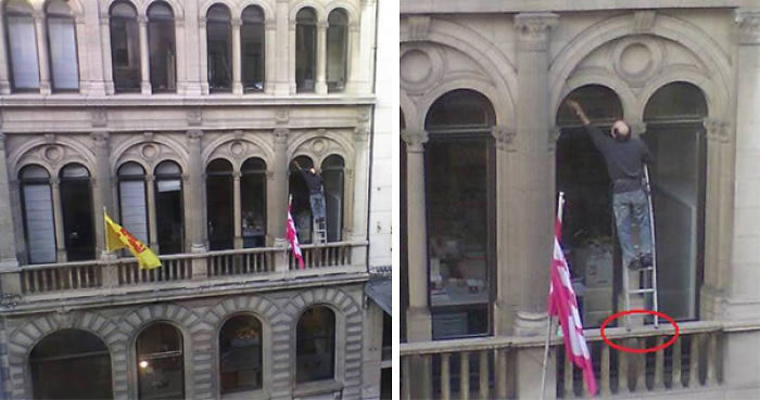 Man balancing precariously on ladder outside tall building window, illustrating reasons women live longer than men.