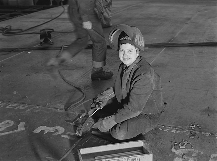 This Woman Worker Pushes Back Her Helmet During A Moment's Pause From Her Welding Job At The Richmond Shipyard In California (1943)