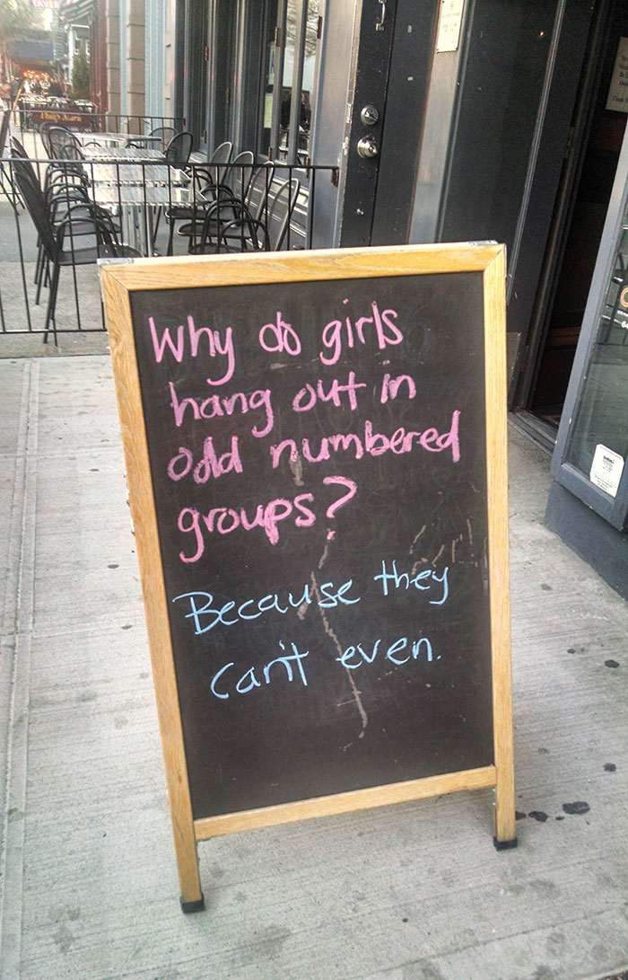 A Sign Outside Of A Bar