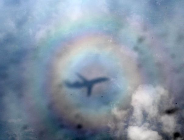 Rare Airplane Shot Taken Inside A Triple Rainbow Circle
