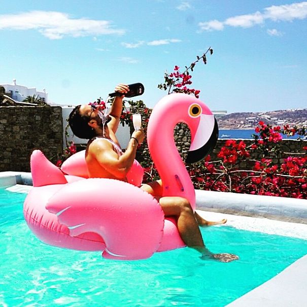 Flamingo Float And A Bottle Of Cris On Top Of The World In #mykonos, #donthatemecuzyouaintme. #weekendgoals