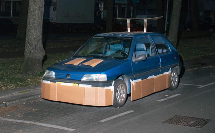 This Guy Walks Around At Night Pimping Random People’s Cars With Cardboard
