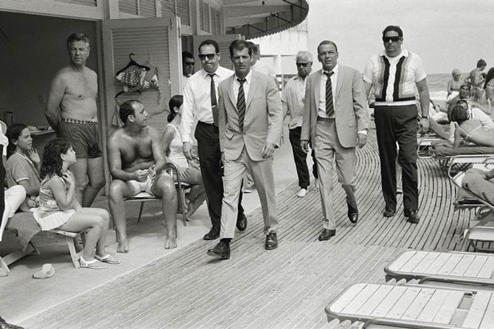 Frank Sinatra Arrives At Miami Beach With His Entourage (1968)