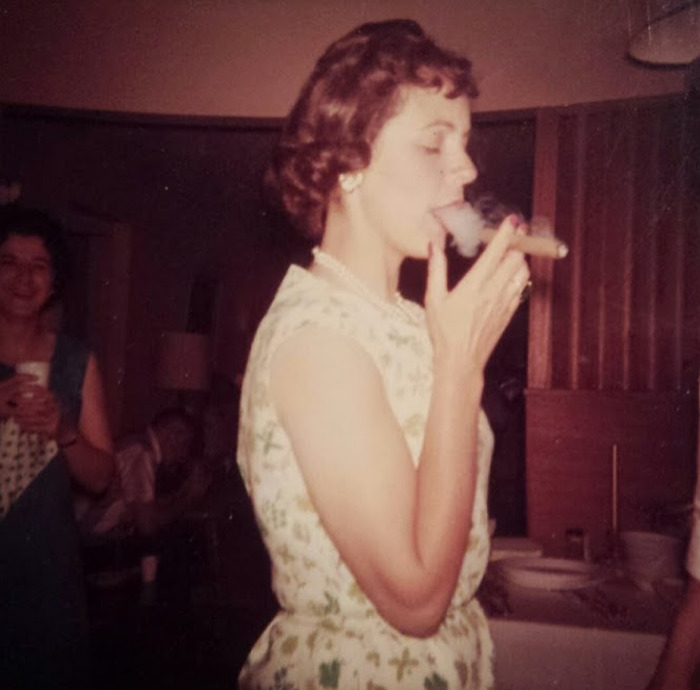 Young Woman Smoking A Cigar; Circa. 1950