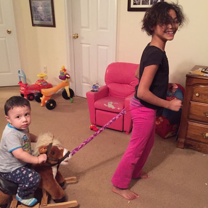 My 9 Yr Old Daughter Tirelessly Pulling Her Little Brother Around On His Horsey.