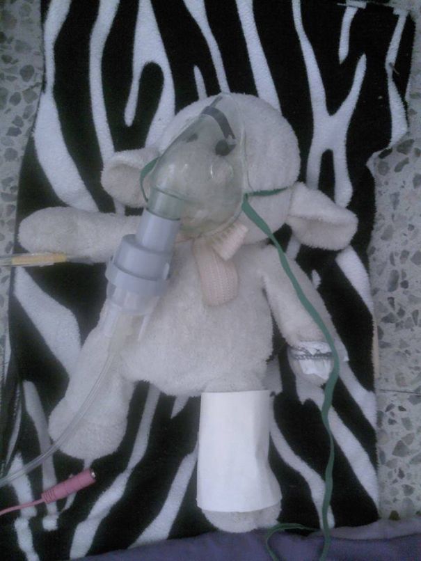 My 8 Year Old, Adriana, Was Taking Care Of Her Toy, Who "had Been In An Accident".