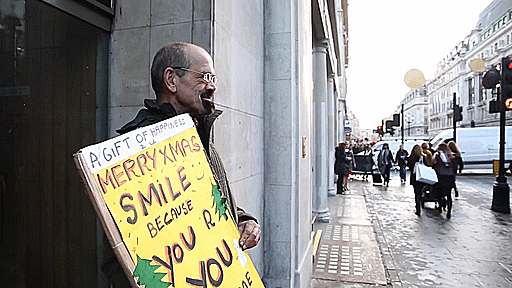 Homeless Man Teaches Passers-By How To Smile And Looks For Job Using Twitter