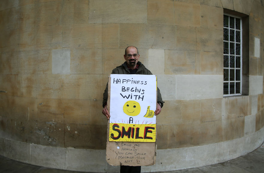 Homeless Man Teaches Passers-By How To Smile And Looks For Job Using Twitter