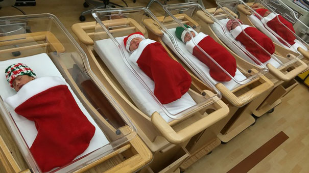 babies born in December wrapped in stockings