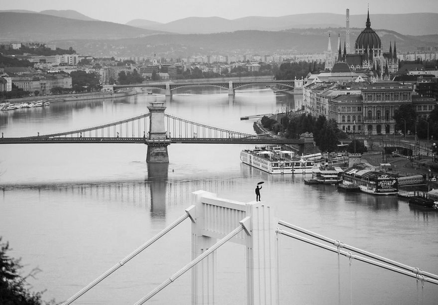 I Captured A Mysterious Umbrella Man Balancing On Budapest’s Famous Sights
