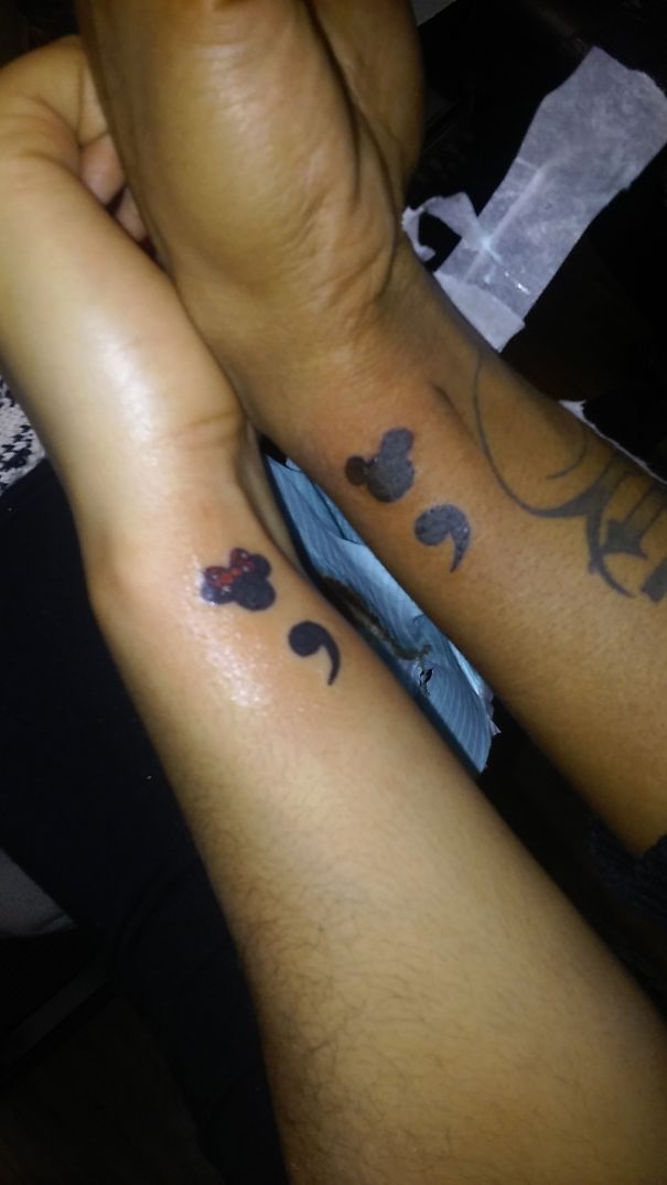 Matching Mickey semicolon tattoo on a couple arms