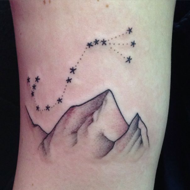 Constellation and mountains tattoo