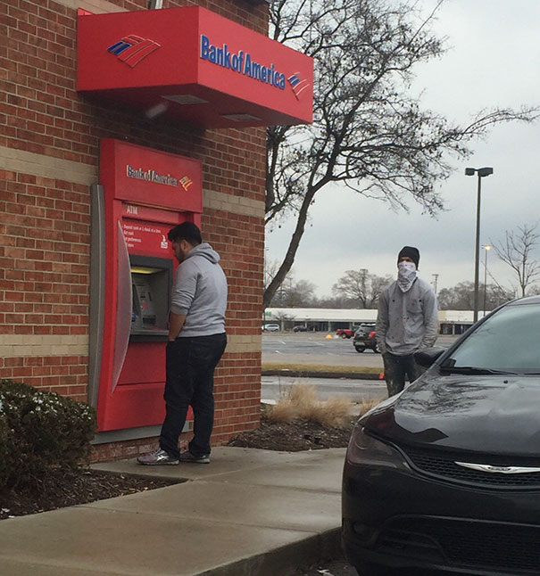 Man Withdrawing Cash From An Atm In Detroit