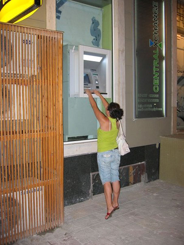 Woman Withdrawing Cash From Atm In Albania
