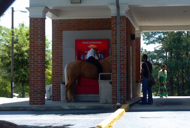 Man Withdrawing Cash From An Atm In Georgia