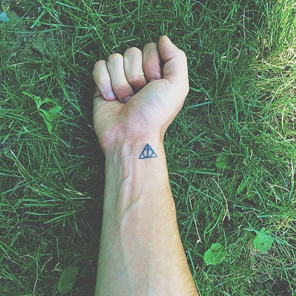 Minimalist Harry Potter symbol wrist tattoo