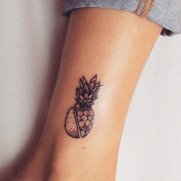 Sliced pineapple tattoo on leg