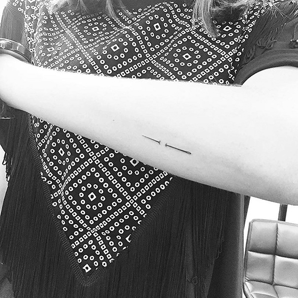 Minimal needle tattoo on arm