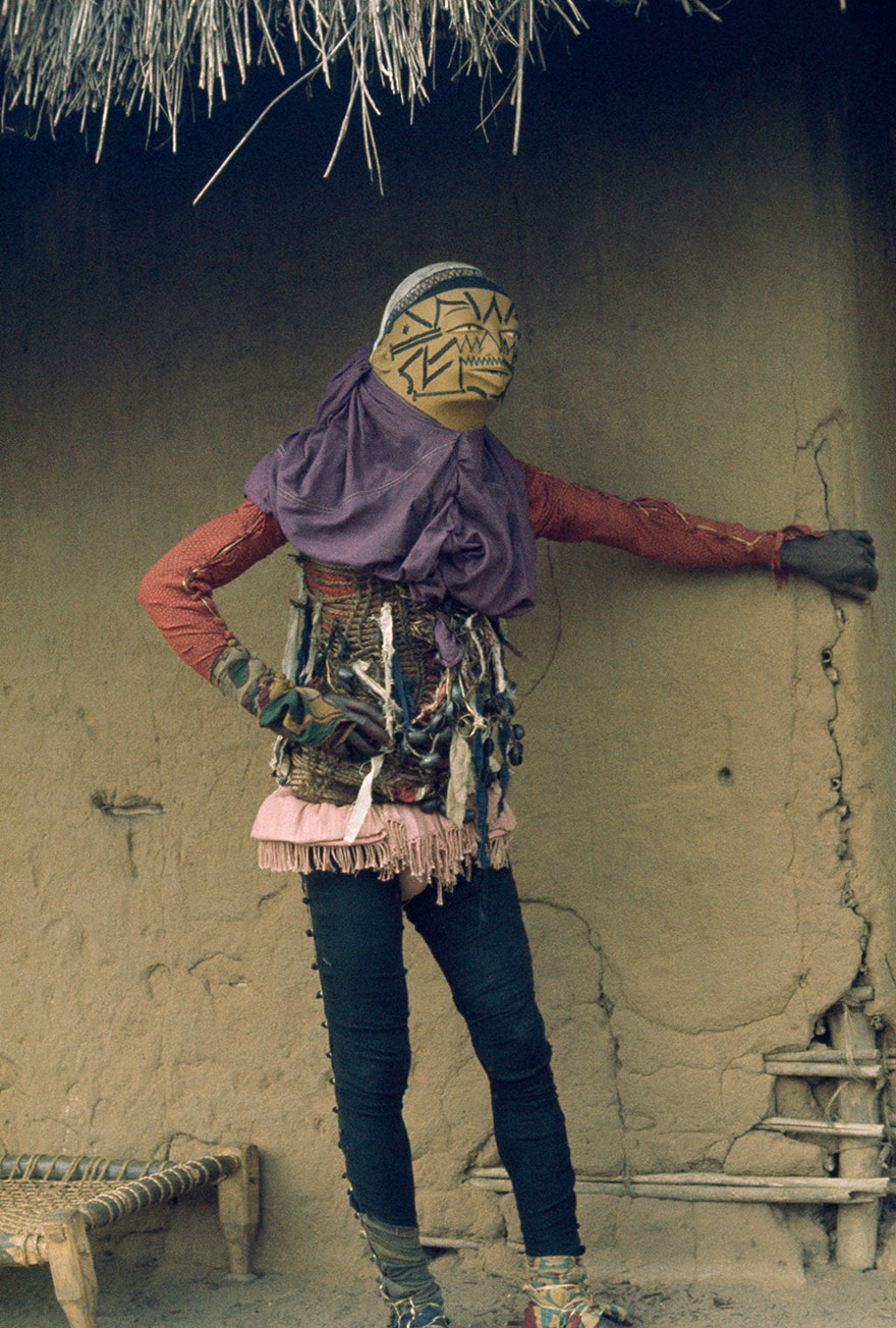 Personifying Evil, A Costumed Mapico Dancer In Mozambique Hides From Spectators, 1964
