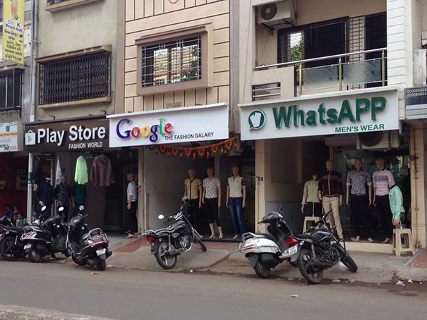Clothes shop signs: ‘Play Store’, ‘Google’, ‘WhatsAPP’