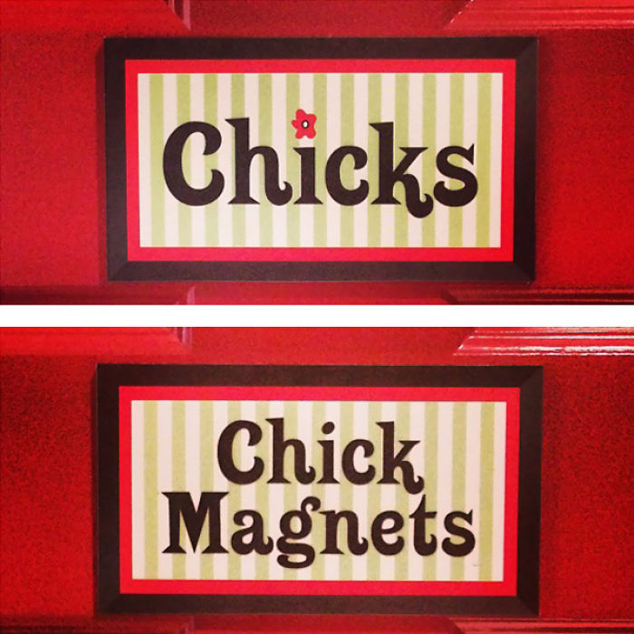 Funny bathroom signs reading Chicks and Chick Magnets displayed on red wall with striped background and black frames.