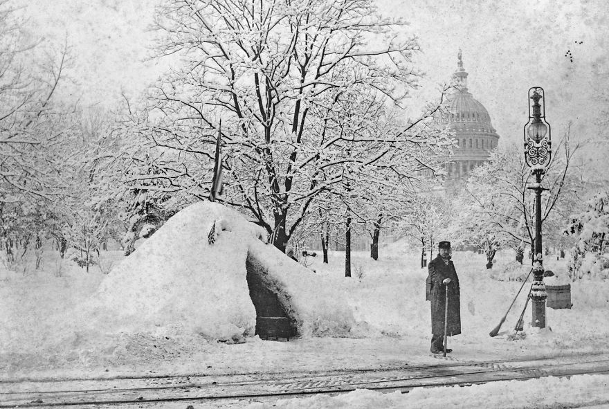 Man Standing By Snow Hut, After Blizzard Of 1888, With U.s. Capitol In Background, Washington
