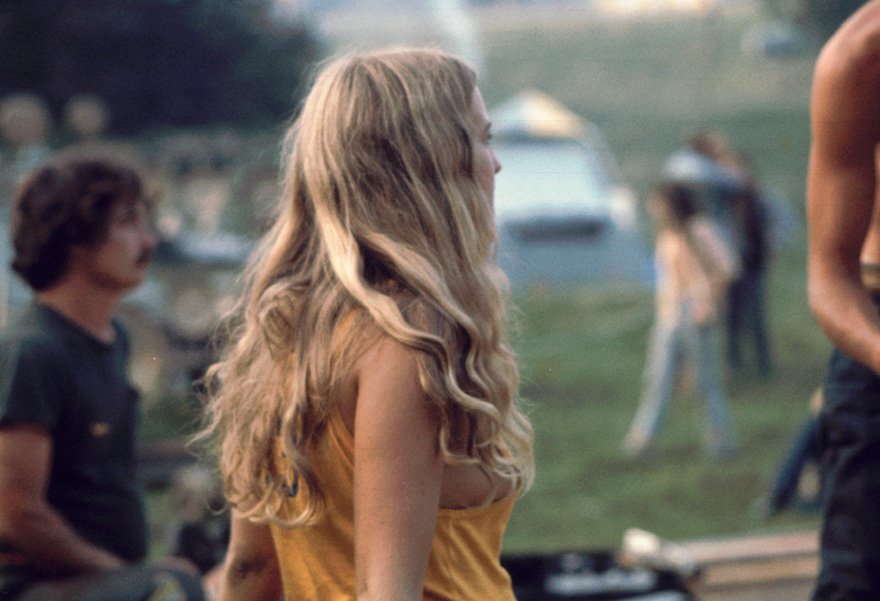 Profile View Of A Young Woman As She Watches A Performance On The 'free Stage' At The Woodstock Music And Arts Fair