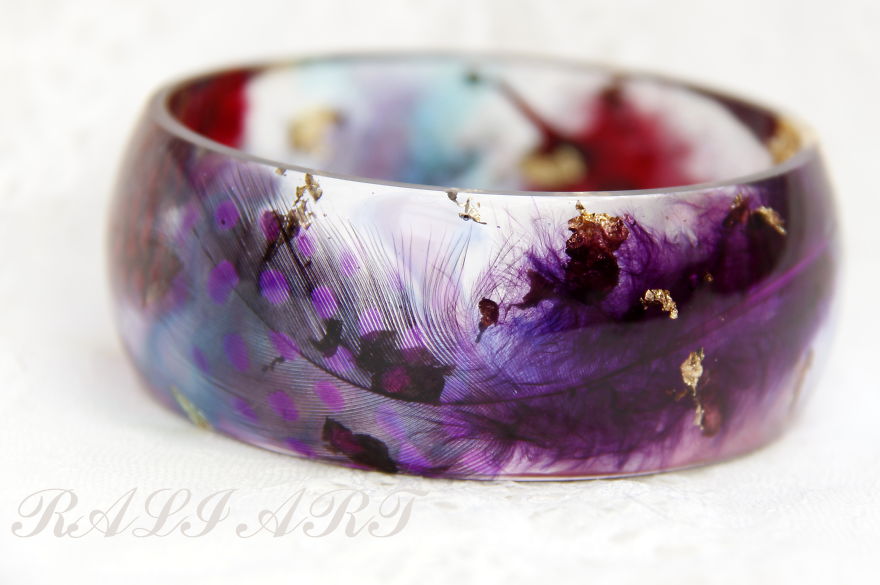 Handmade Jewelry From A Resin And Feathers.