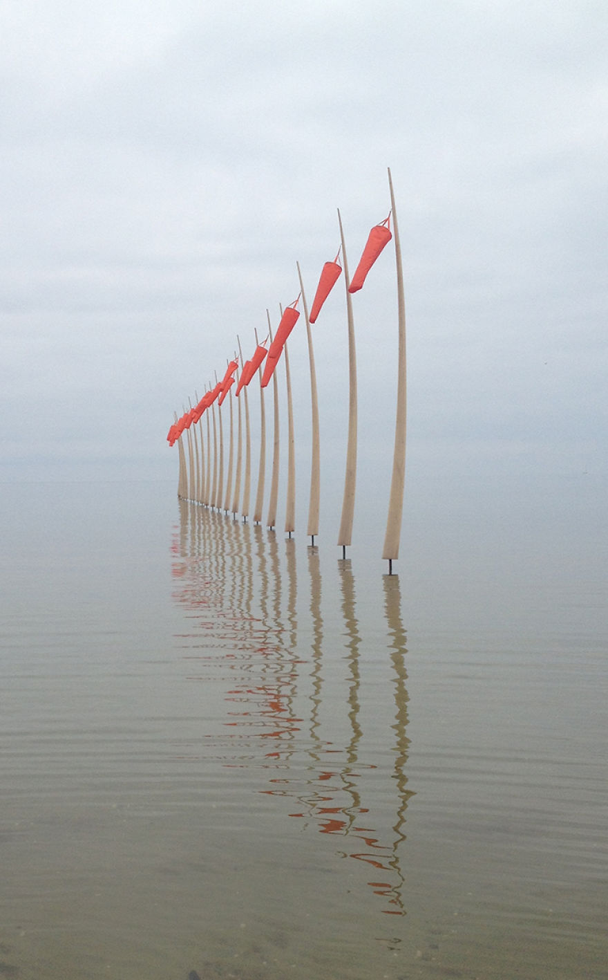 Artist Takes Art Exhibition To Another Level By Placing His Wooden Sculptures Right In The Sea