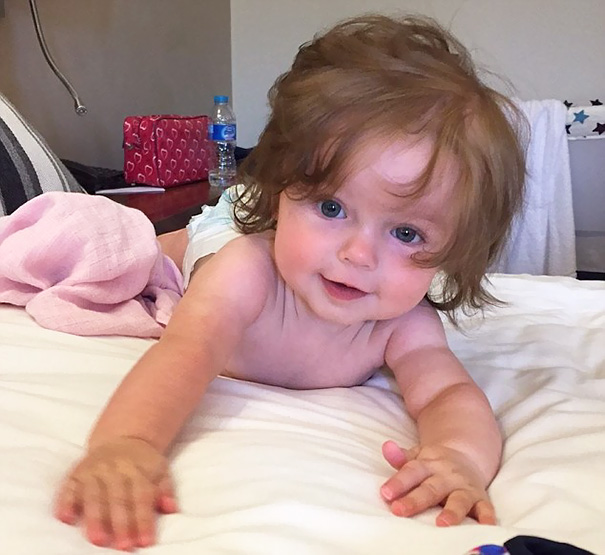 Cute Curtains: At Seven Months Old, Olivia's Hair Falls Over Her Face And Reaches Her Shoulders