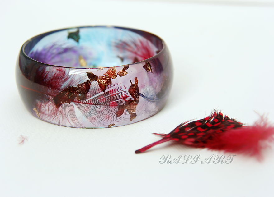 Handmade Jewelry From A Resin And Feathers.