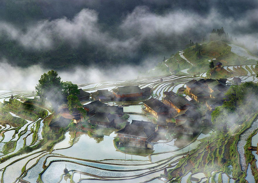 Terraces Village In The Mist, China