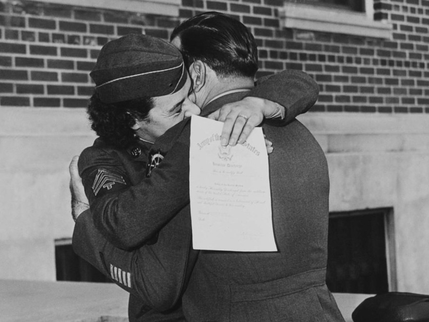 Women’s Army Corp Member Kissing Her Husband, Upon Discharge January 1, 1945