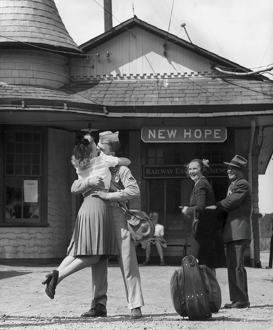A Young Woman Lifts Her Feet While Embracing And Kissing A Uniformed Us Soldier At The Train Station, Connecticut, 1945