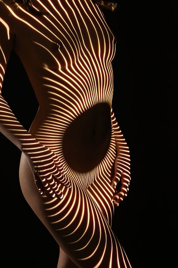 Photographer Dresses Nude Women In Light And Shadows (NSFW)
