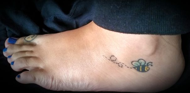 Flying bee ankle tattoo