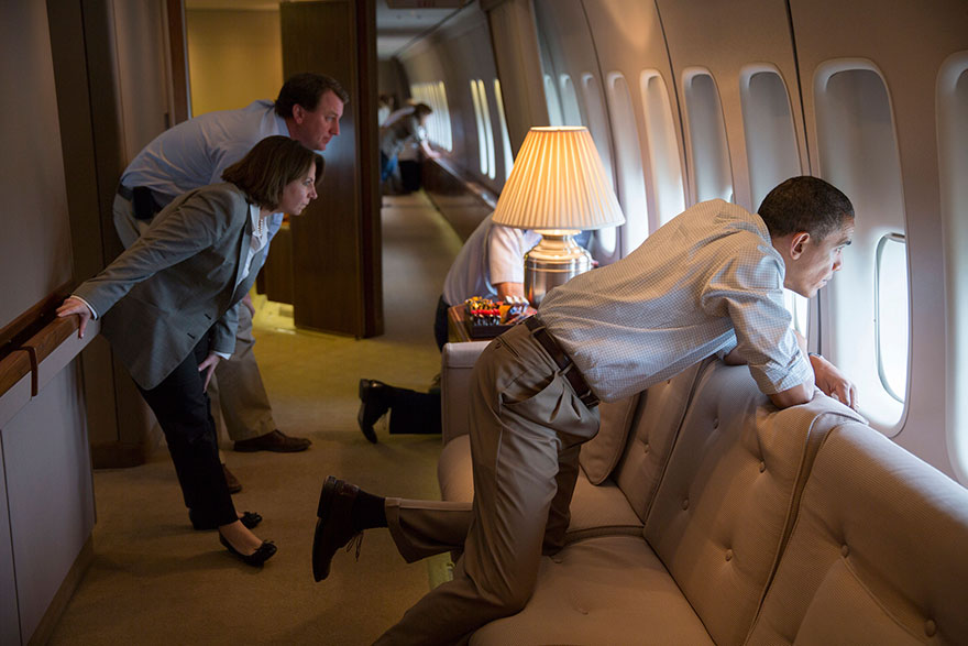 The President And Members Of The White House Staff Look Out The Window Of Air Force One To View Tornado Damage Over Moore, Oklahoma