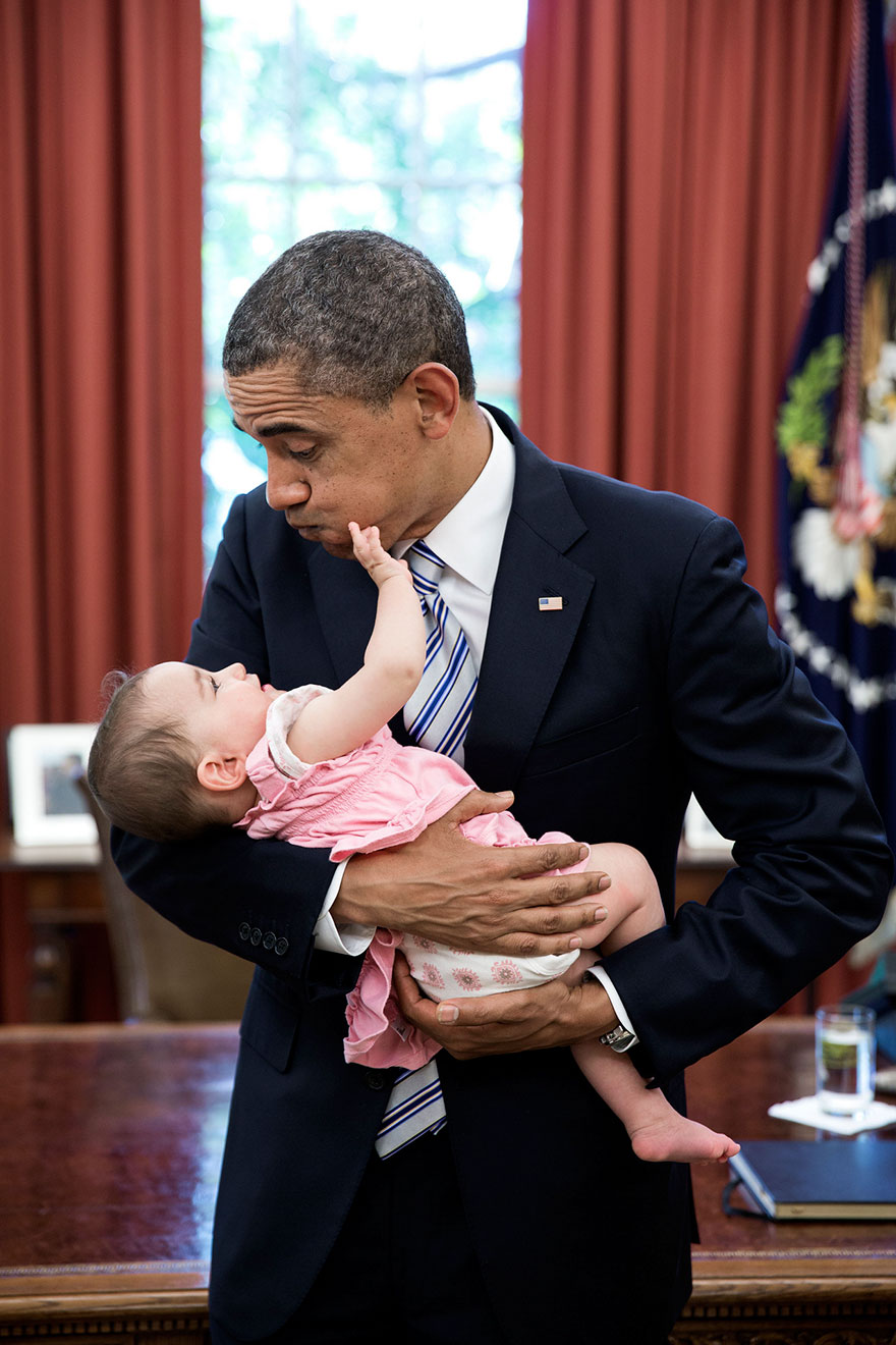 President Barack Obama Holds Six-Month-Old Talia Neufeld, Daughter Of Departing Staff Member Adam Neufeld
