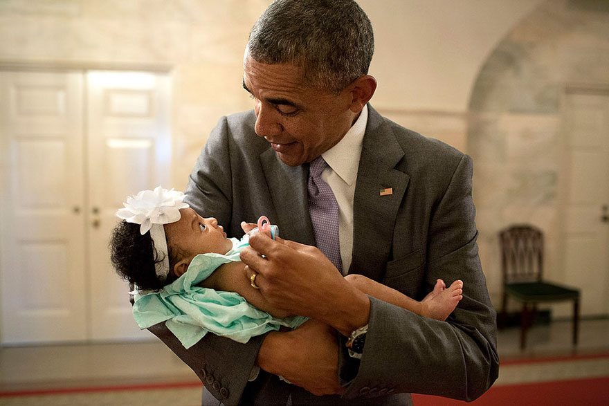 President Barack Obama Holds The Baby Daughter Of Former Staff Members Darienne Page Rakestraw And London Rakestraw