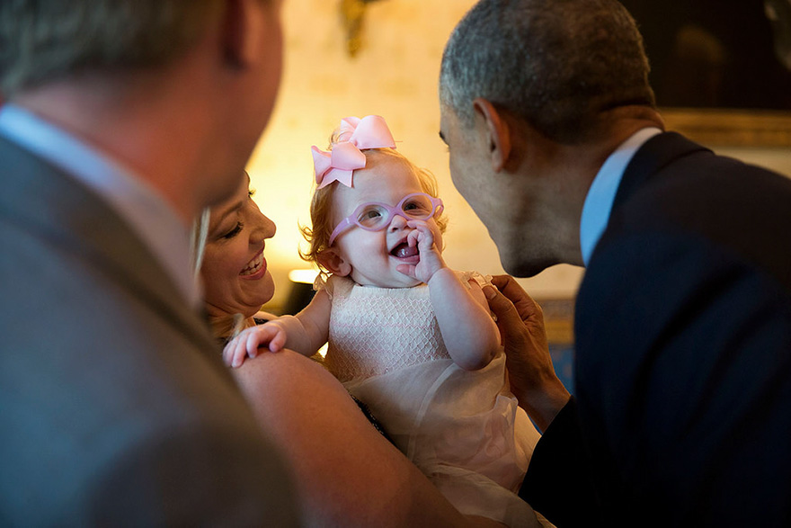 President Barack Obama Greets Zoe Mahan, Daughter Of Hunter And Kandi Mahan, During A Reception For The 2013 President's Cup Championship Golf Teams