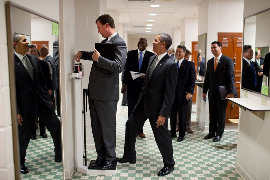 President Barack Obama Jokingly Puts His Toe On The Scale As Trip Director Marvin Nicholson Weighs Himself