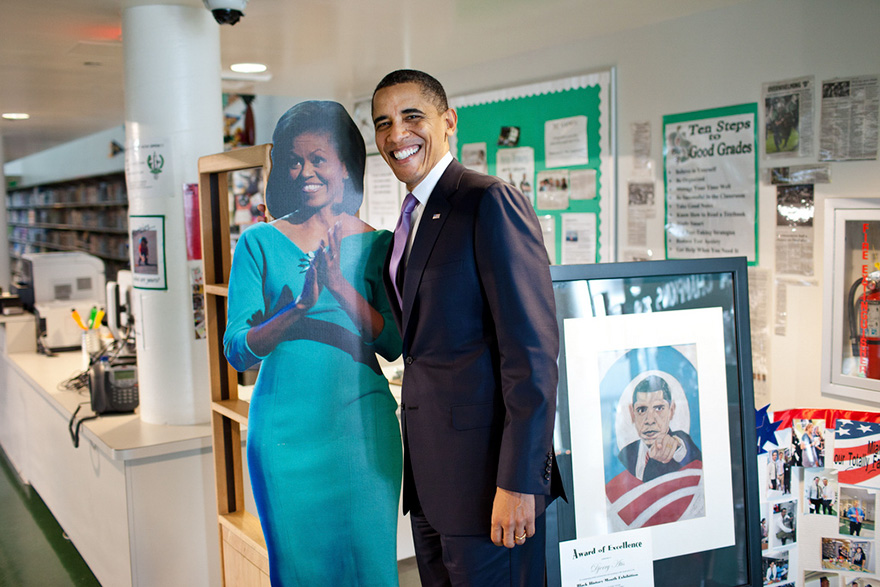 President Barack Obama Stands By A Cut-Out Picture Of First Lady Michelle Obama During A Visit To Miami Central High School