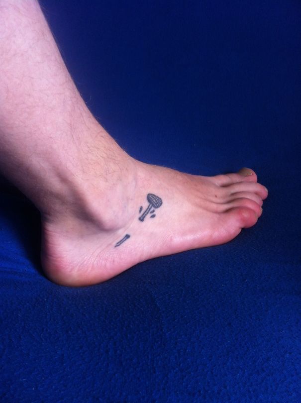 Hammer and nail ankle tattoo