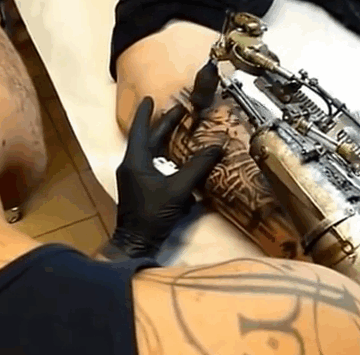 Tattoo Artist Who Lost His Arm Gets World's First Tattoo Machine Prosthesis